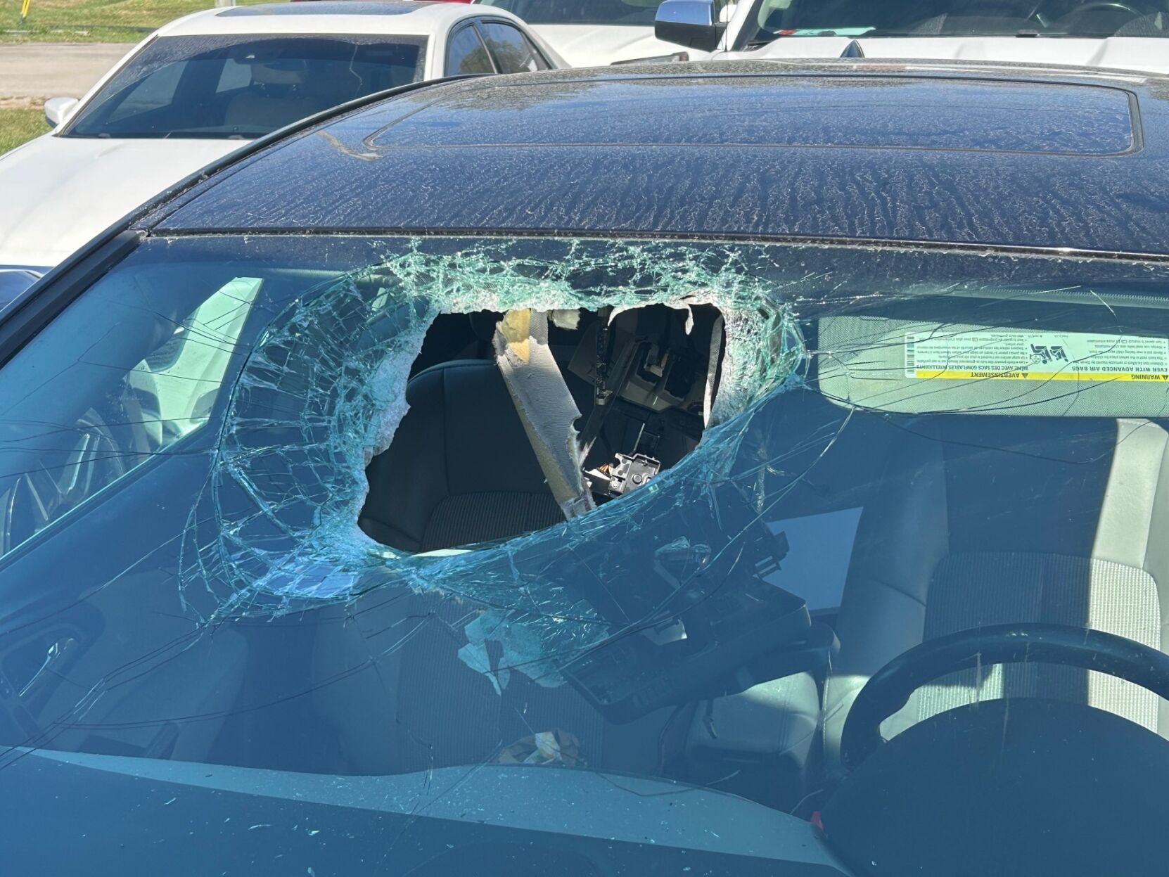 METAL SMASHES THROUGH CAR 2.jpg